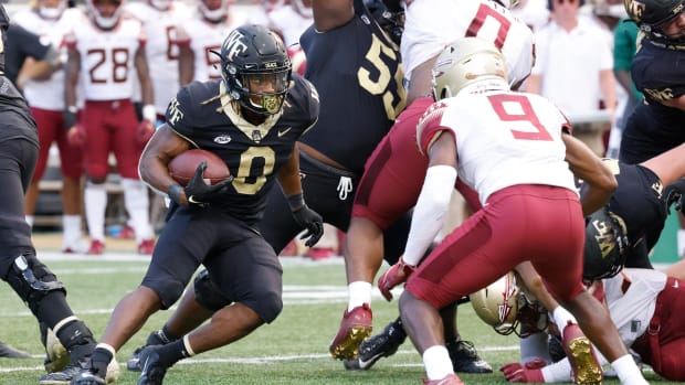 Sep 18, 2021; Winston-Salem, North Carolina, USA; Florida State Seminoles defensive back Meiko Dotson (9) defends Wake Forest Demon Deacons running back Christian Turner (0) during the second half at Truist Field. Mandatory Credit: Reinhold Matay-USA TODAY Sports  